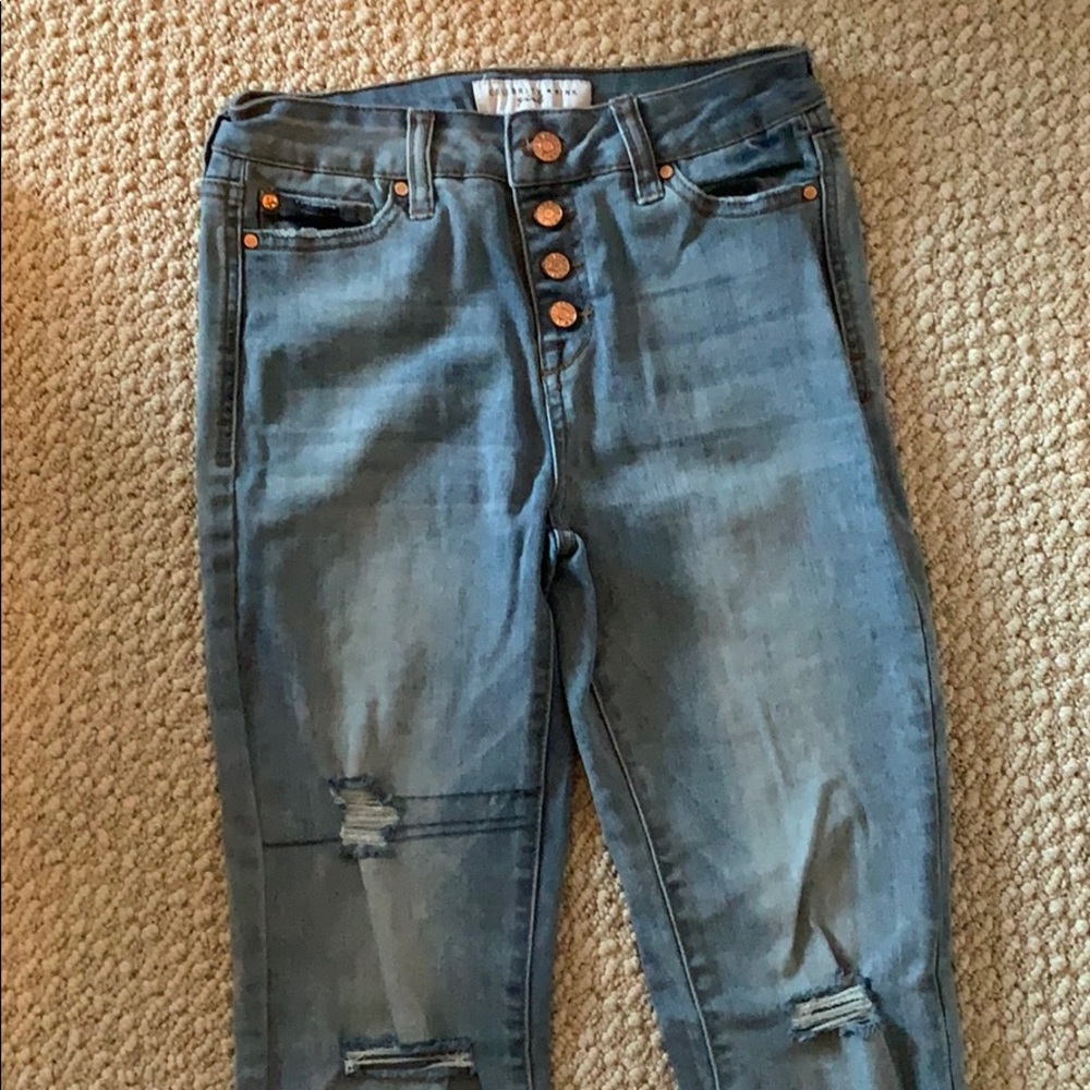 Celebrity pink ripped jeans